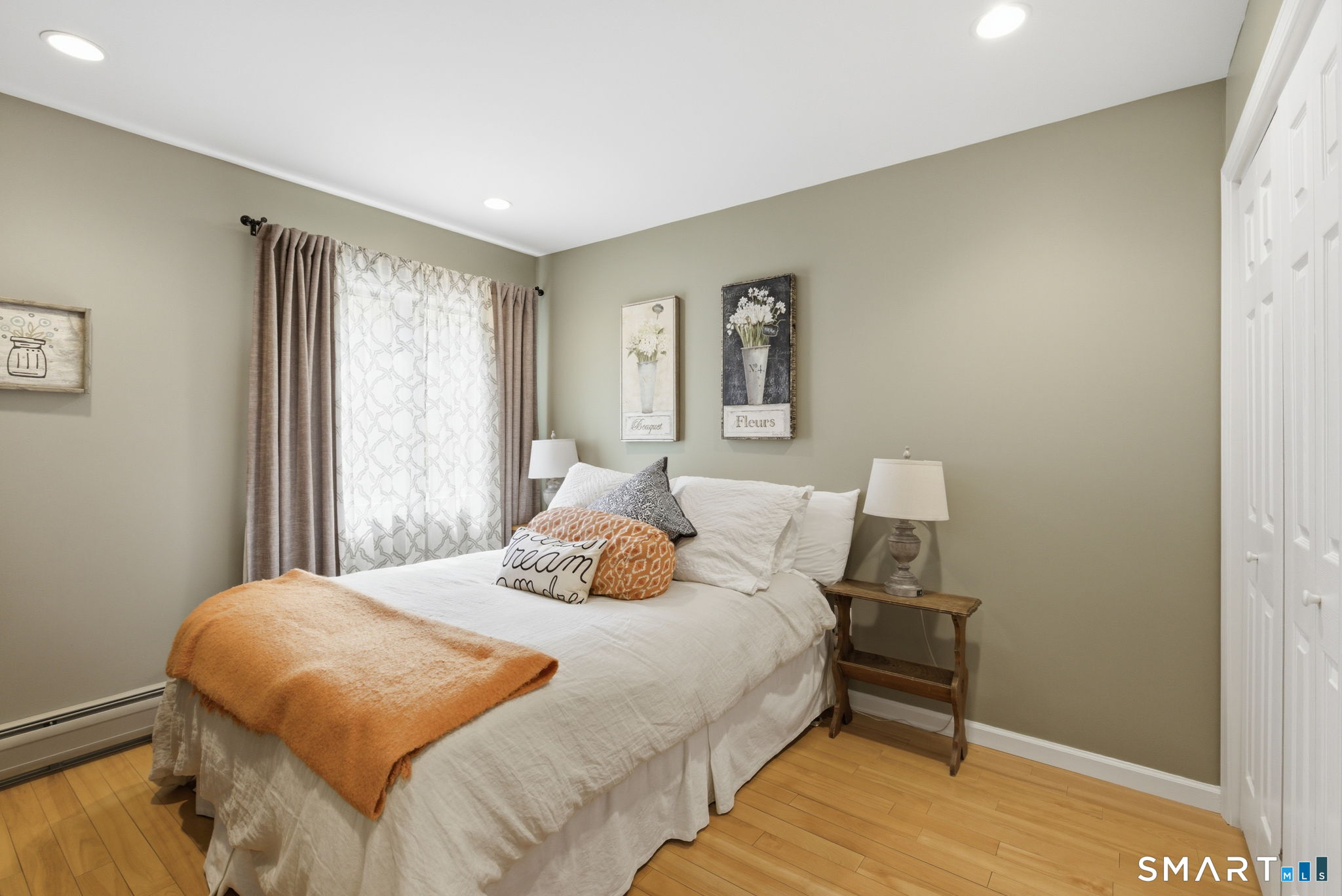 10 Ryans Way Burlington, CT 06013 - Photo 23 of 35 a bedroom with a bed and wooden floor