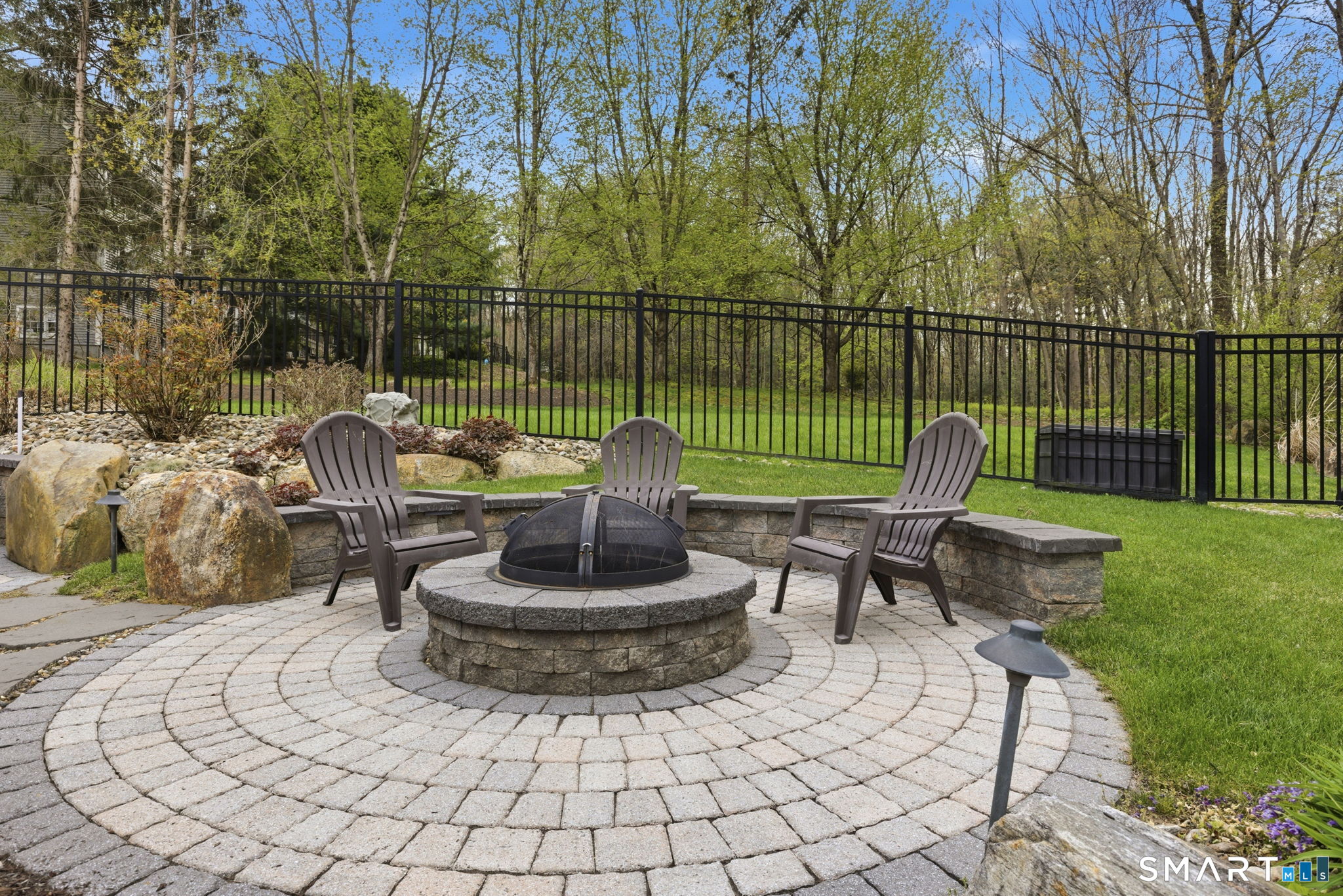 10 Ryans Way Burlington, CT 06013 - Photo 31 of 35 a house view with a sitting space and garden