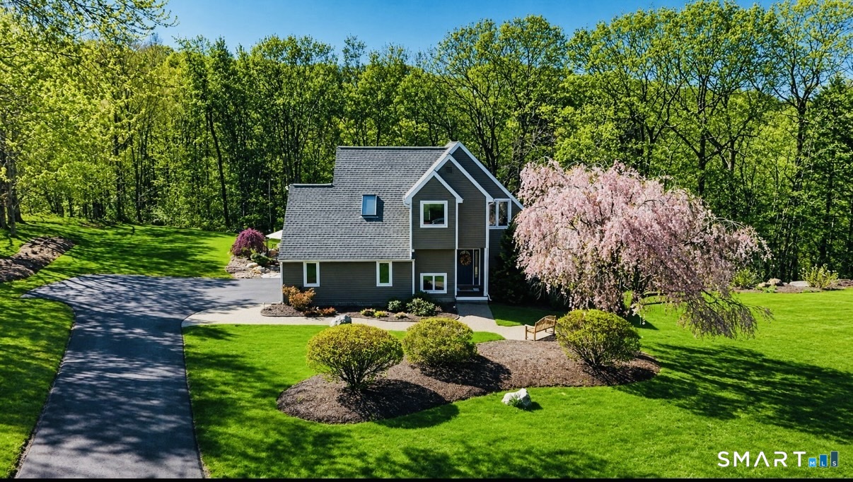 10 Ryans Way Burlington, CT 06013 - Photo 4 of 35 a front view of house with yard and green space