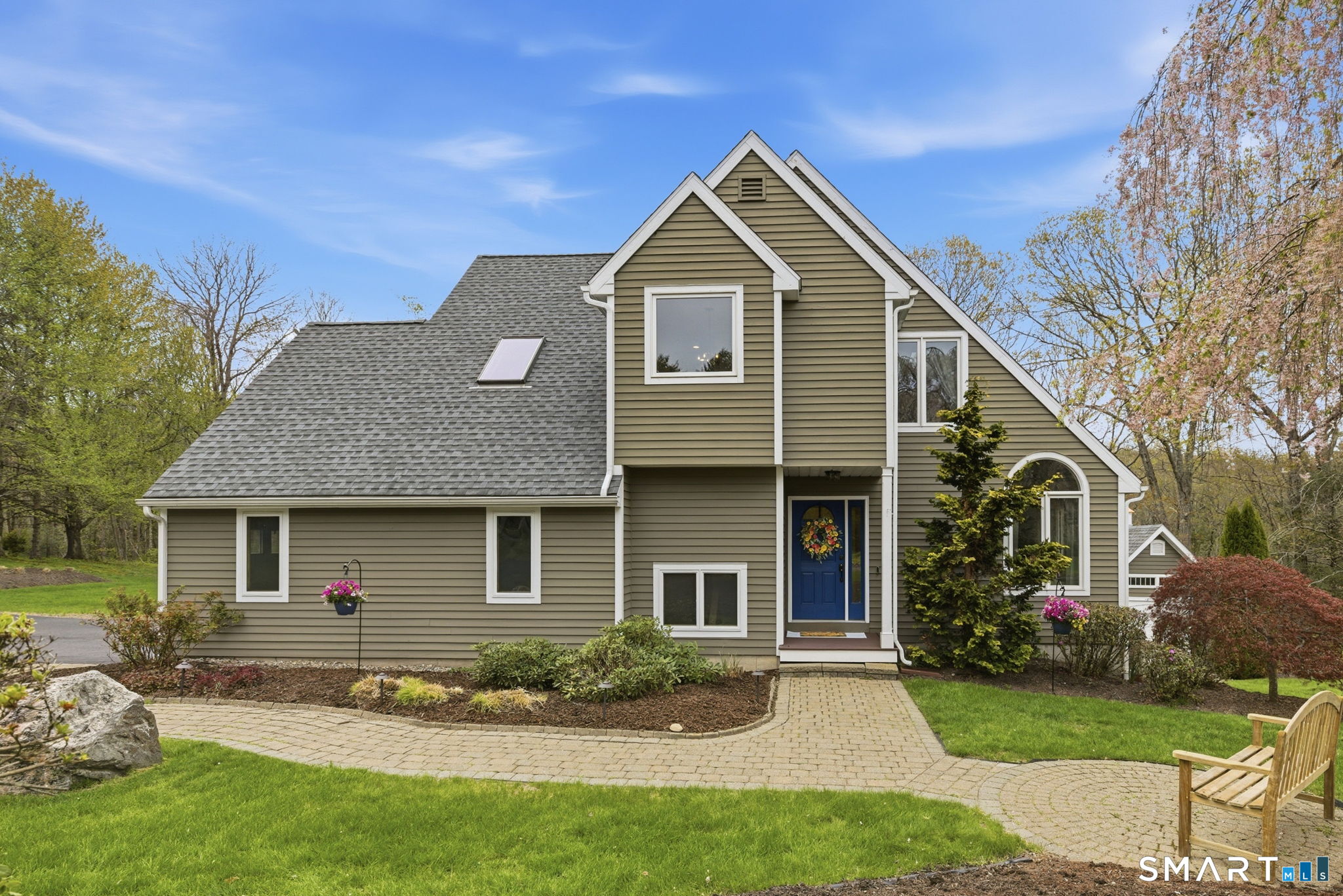 10 Ryans Way Burlington, CT 06013 - Photo 6 of 35 a front view of a house with a garden