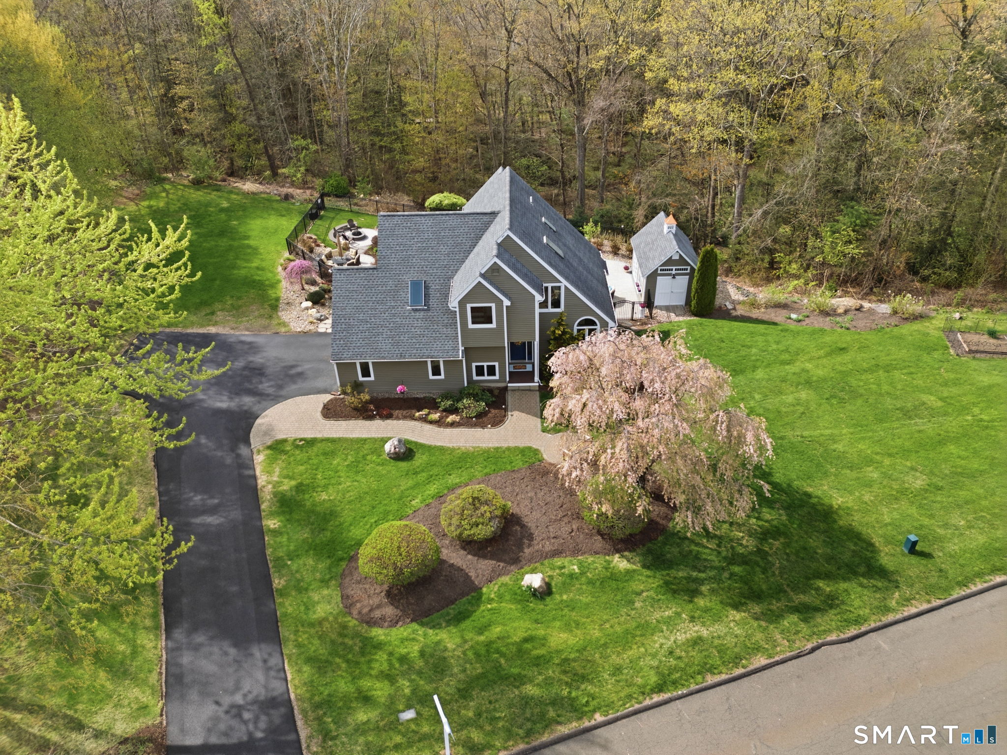 10 Ryans Way Burlington, CT 06013 - Photo 9 of 35 a view of a house with a yard and plants