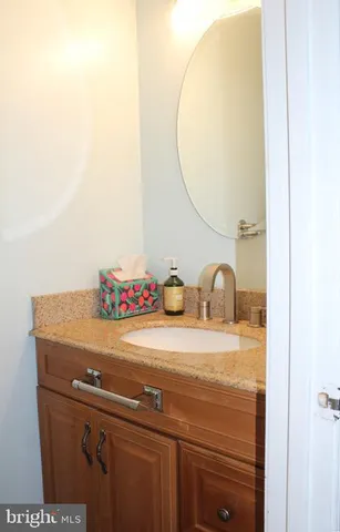 a view of staircase with railing and white walls