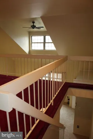 a white toilet sitting next to a bathroom sink
