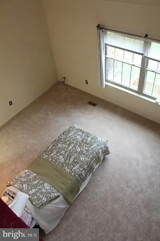 a white toilet sitting next to a white sink