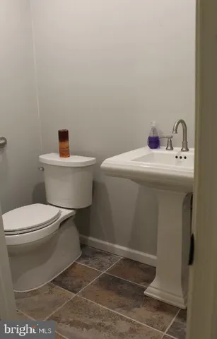 a view of a field with trees in the background