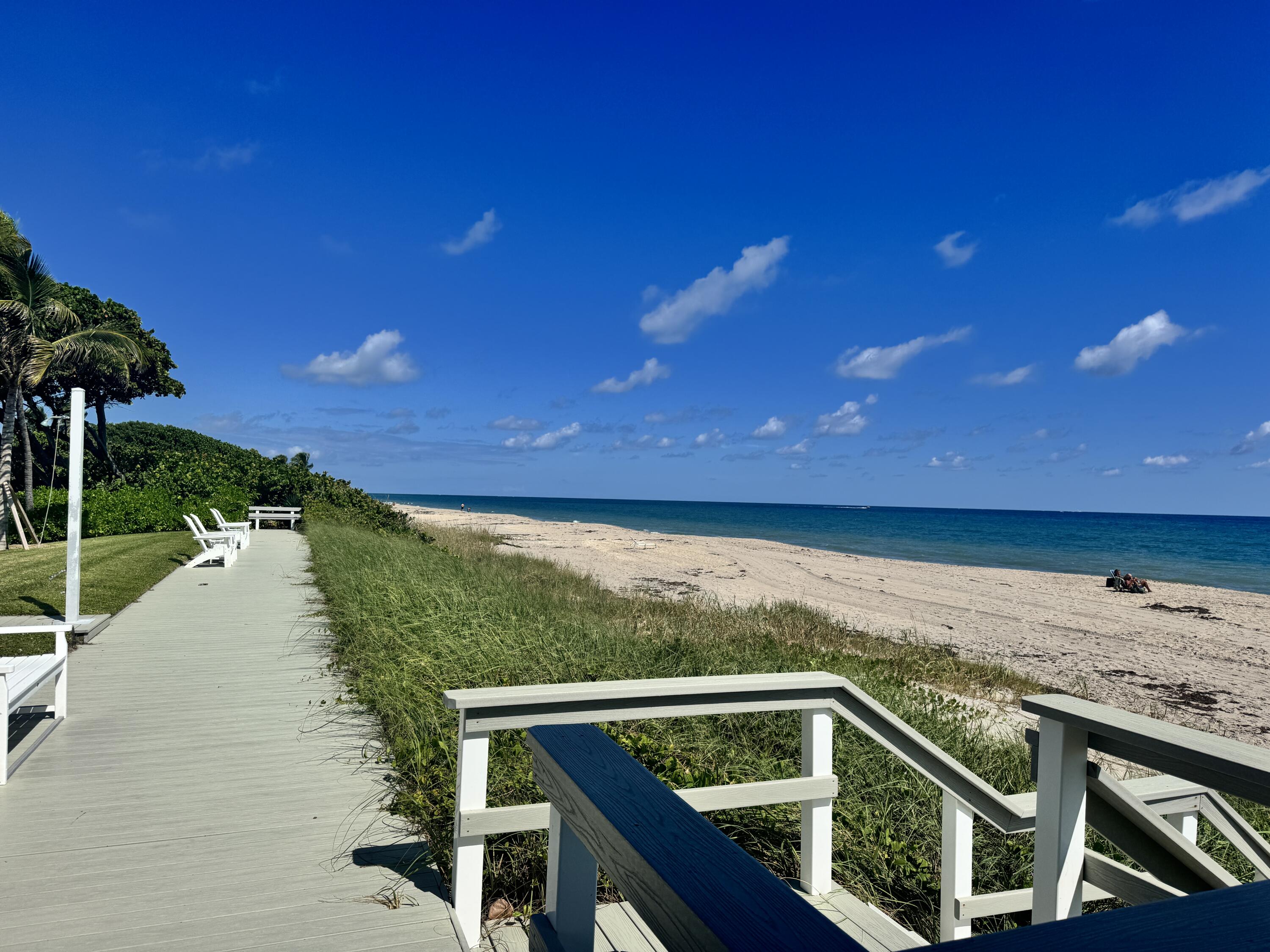 a view of a balcony with an ocean view