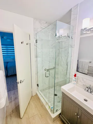 a bathroom with a sink and shower