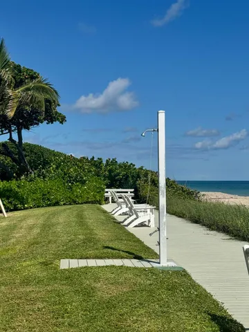 a view of a swimming pool with a yard