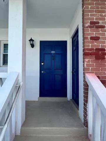 a view of a hallway and cabinets