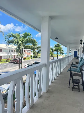 a view of a porch and a yard