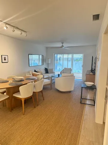 a living room with furniture and a table