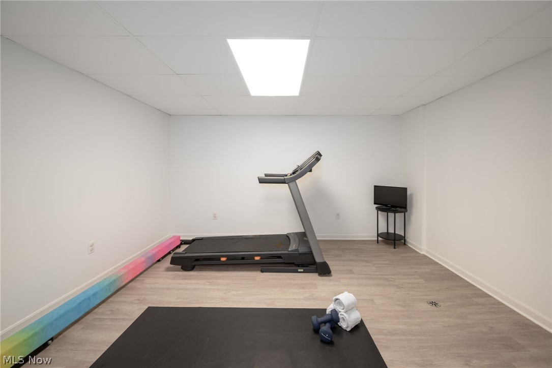 3912 Raintree Circle Uniontown, OH 44685 - Photo 33 of 49 Home gym room with light floors and a paneled ceiling