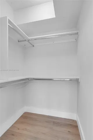 a view of an empty walk in closet