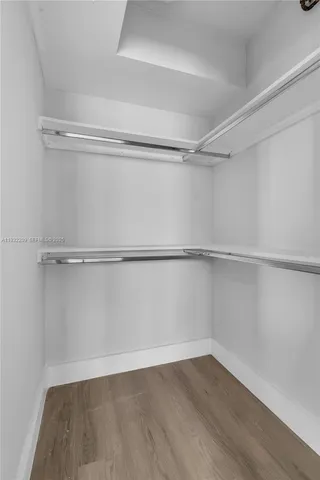 a view of an empty walk in closet
