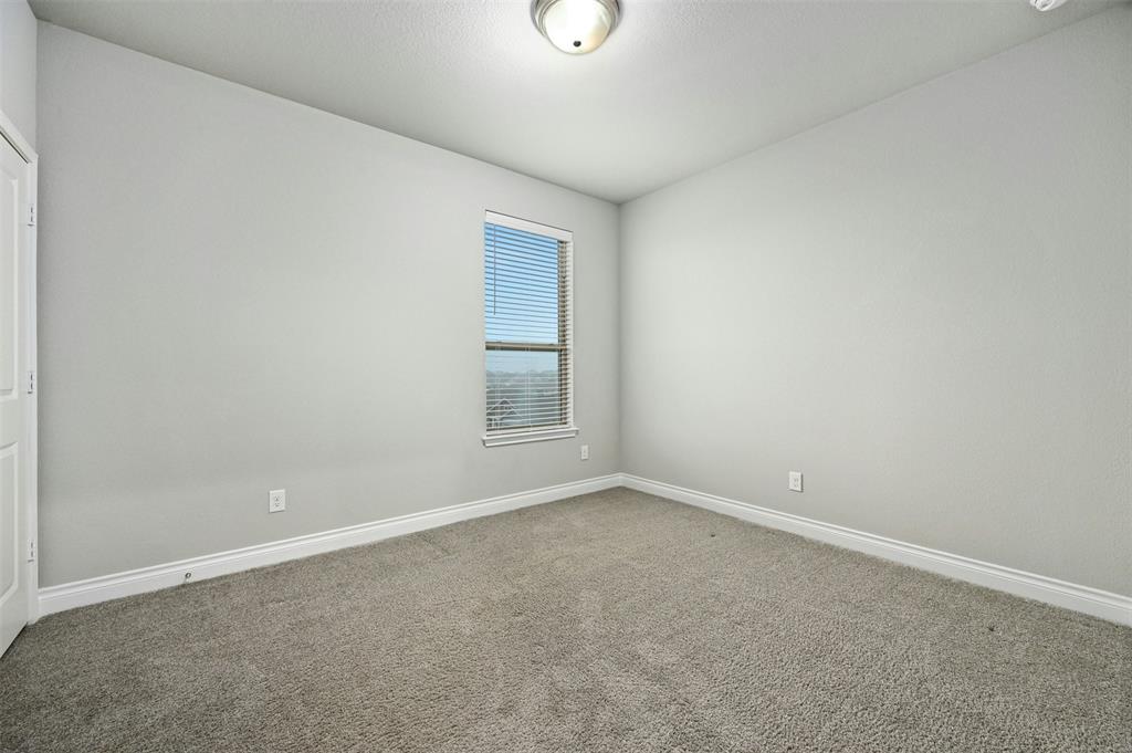 132 Santa Maria Street Georgetown, TX 78628 - Photo 27 of 36 Carpeted spare room featuring baseboards