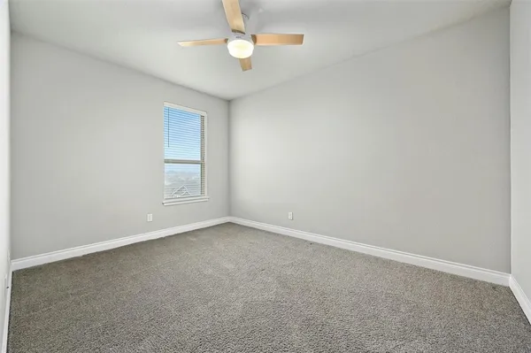 a view of an empty room with a balcony