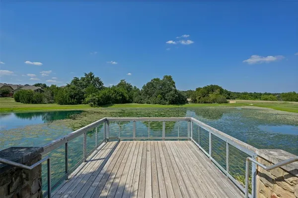 a view of lake with green space