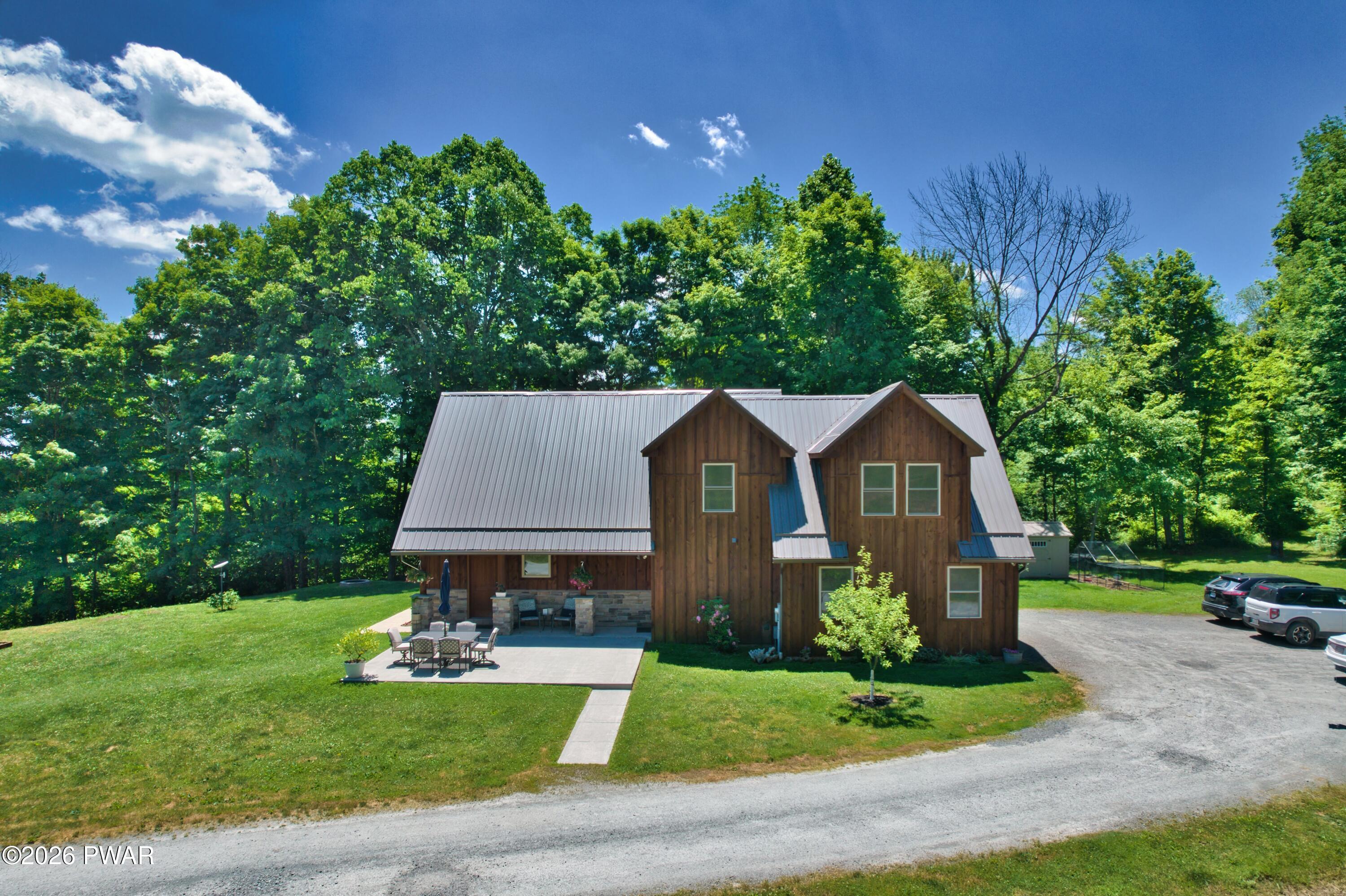 149 Sheards Road Milanville, PA 18443 - Photo 3 of 57 a view of a yard in front of house with a yard