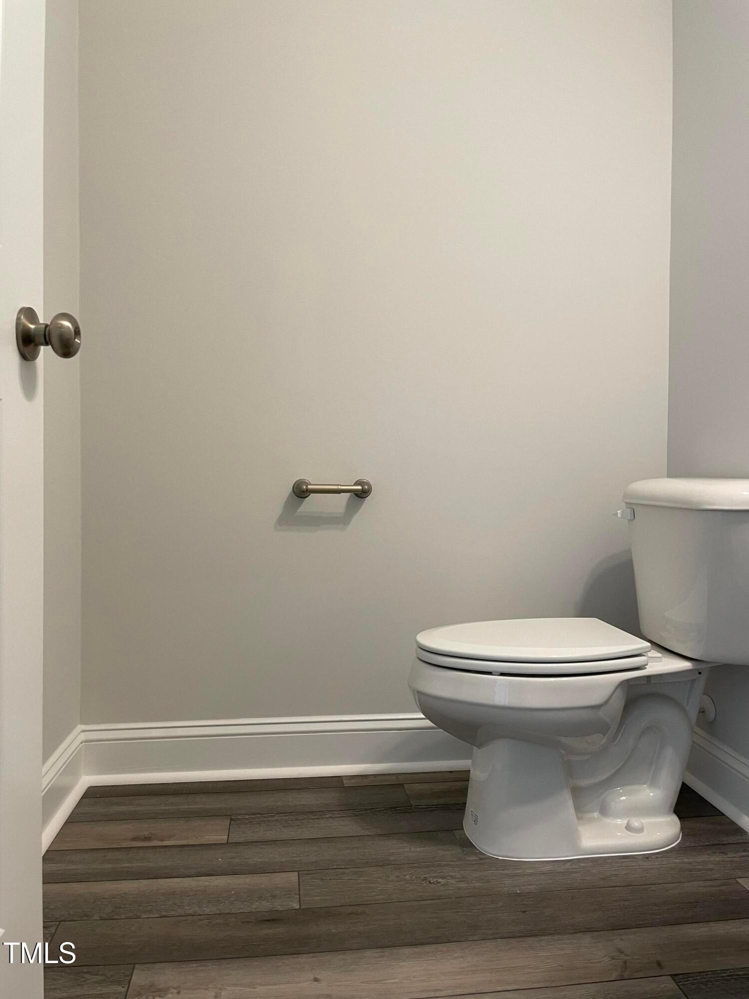 308 Edge Of Auburn Boulevard Raleigh, NC 27610 - Photo 18 of 23 a bathroom with a toilet and a mirror