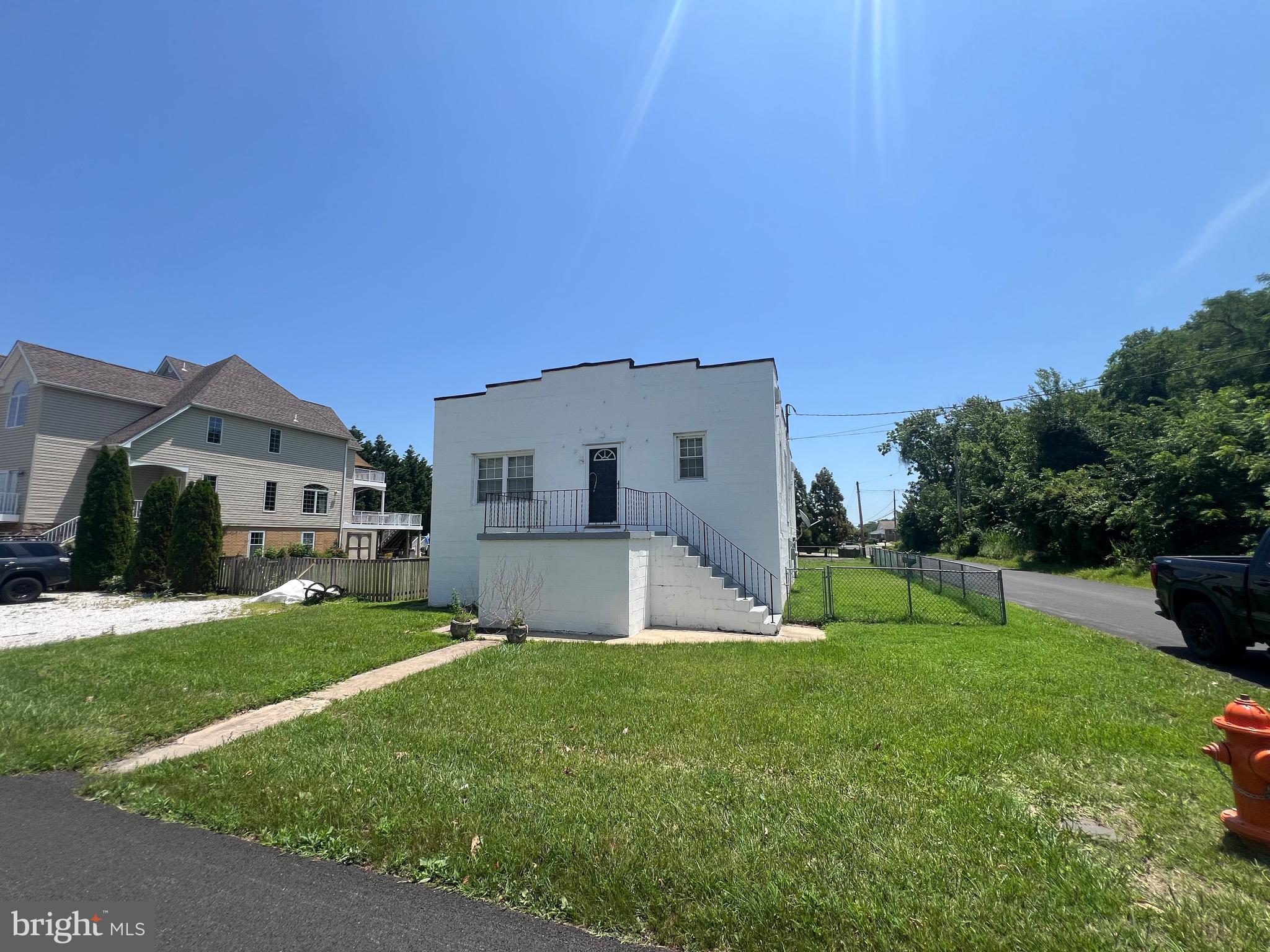 9015 Cuckold Point Road Baltimore, MD 21219 - Photo 2 of 12 a house view with a sitting space and garden