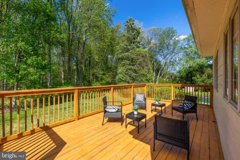 a view of a balcony with chairs
