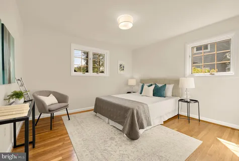 a bedroom with a bed and a table