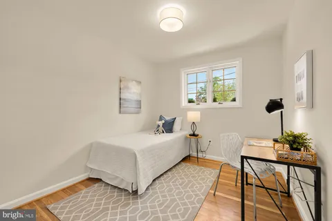 a room with a bed and a window