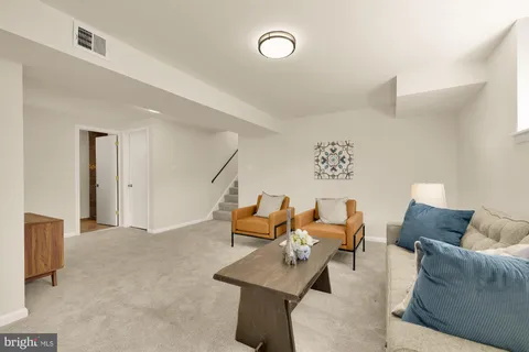 a living room with furniture and a couch