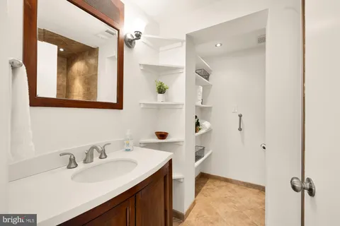 a bathroom with a sink and a mirror