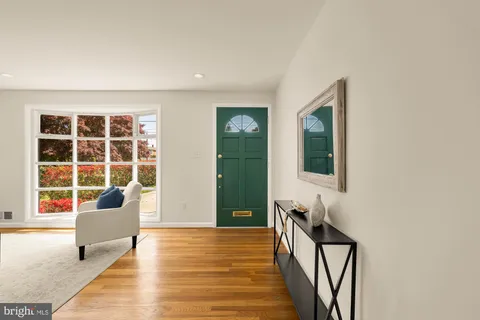 a view of a livingroom with furniture and windows