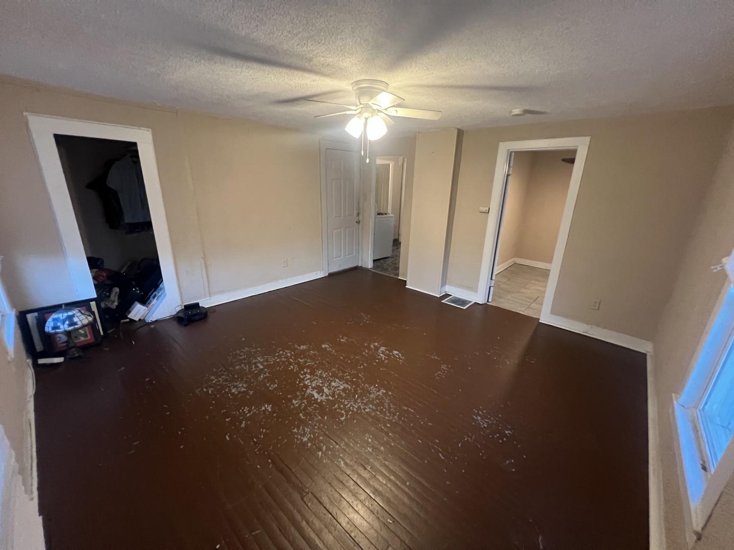 307 South 4th Avenue, Unit 3 Kankakee, IL 60901 - Photo 3 of 9 a view of a livingroom with a hardwood floor and a ceiling fan