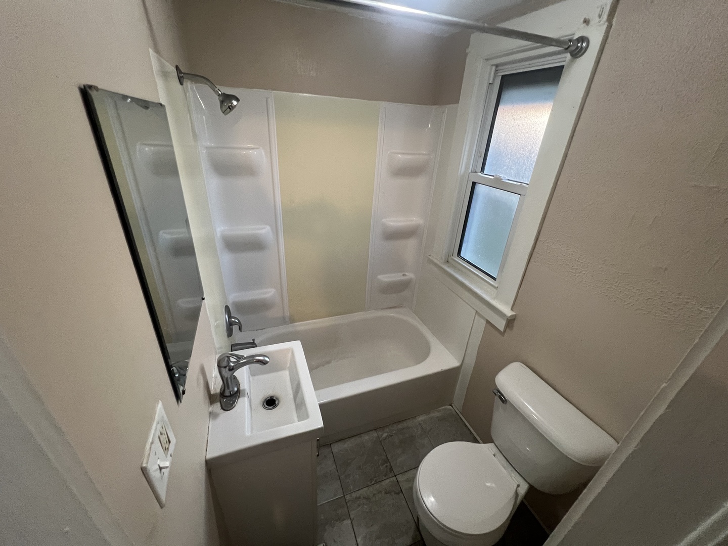 307 South 4th Avenue, Unit 3 Kankakee, IL 60901 - Photo 9 of 9 a white toilet sitting next to a bathroom sink