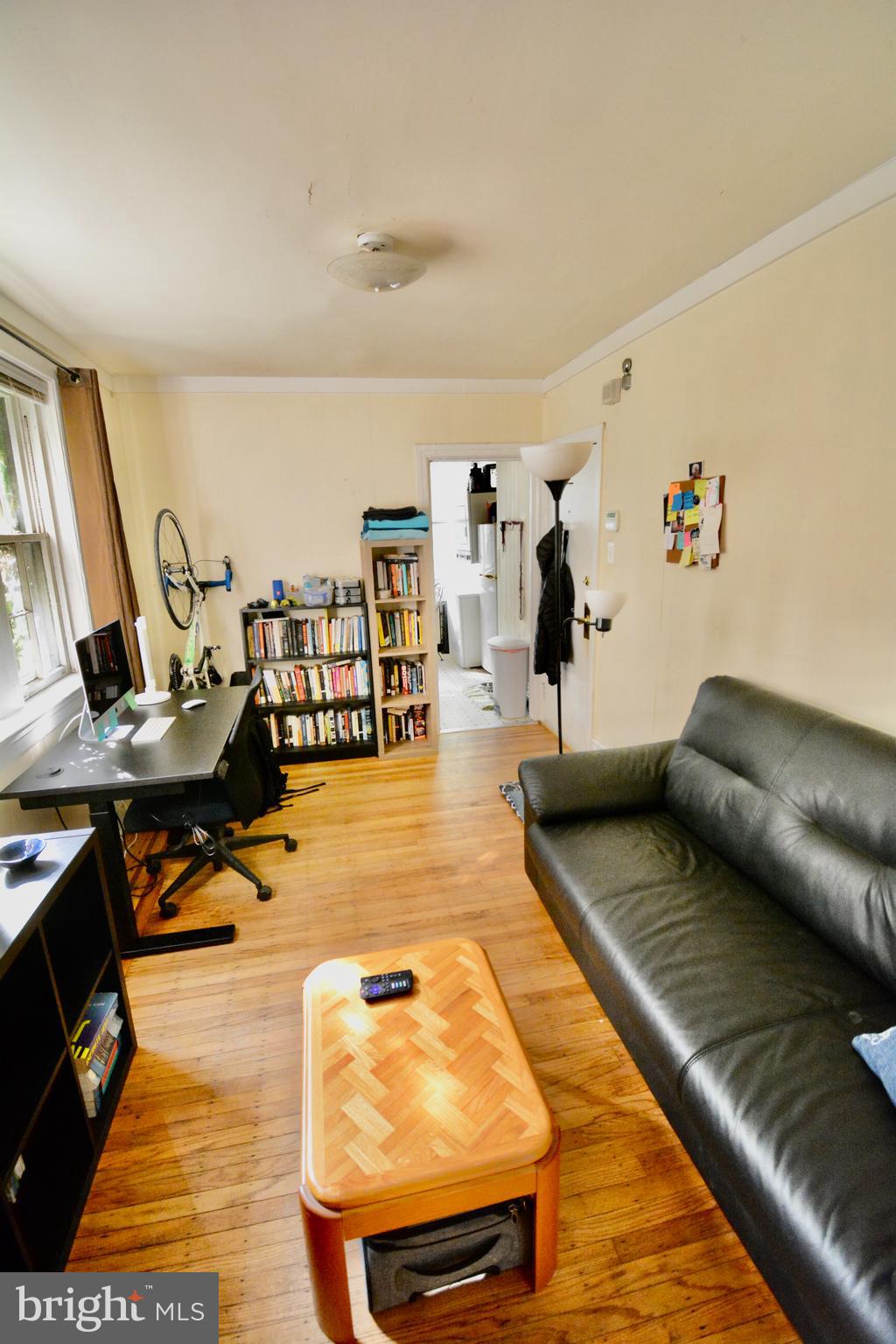 506 West Coulter Street, Unit 1 Philadelphia, PA 19144 - Photo 2 of 11 a living room with lots of furniture and painting on the wall