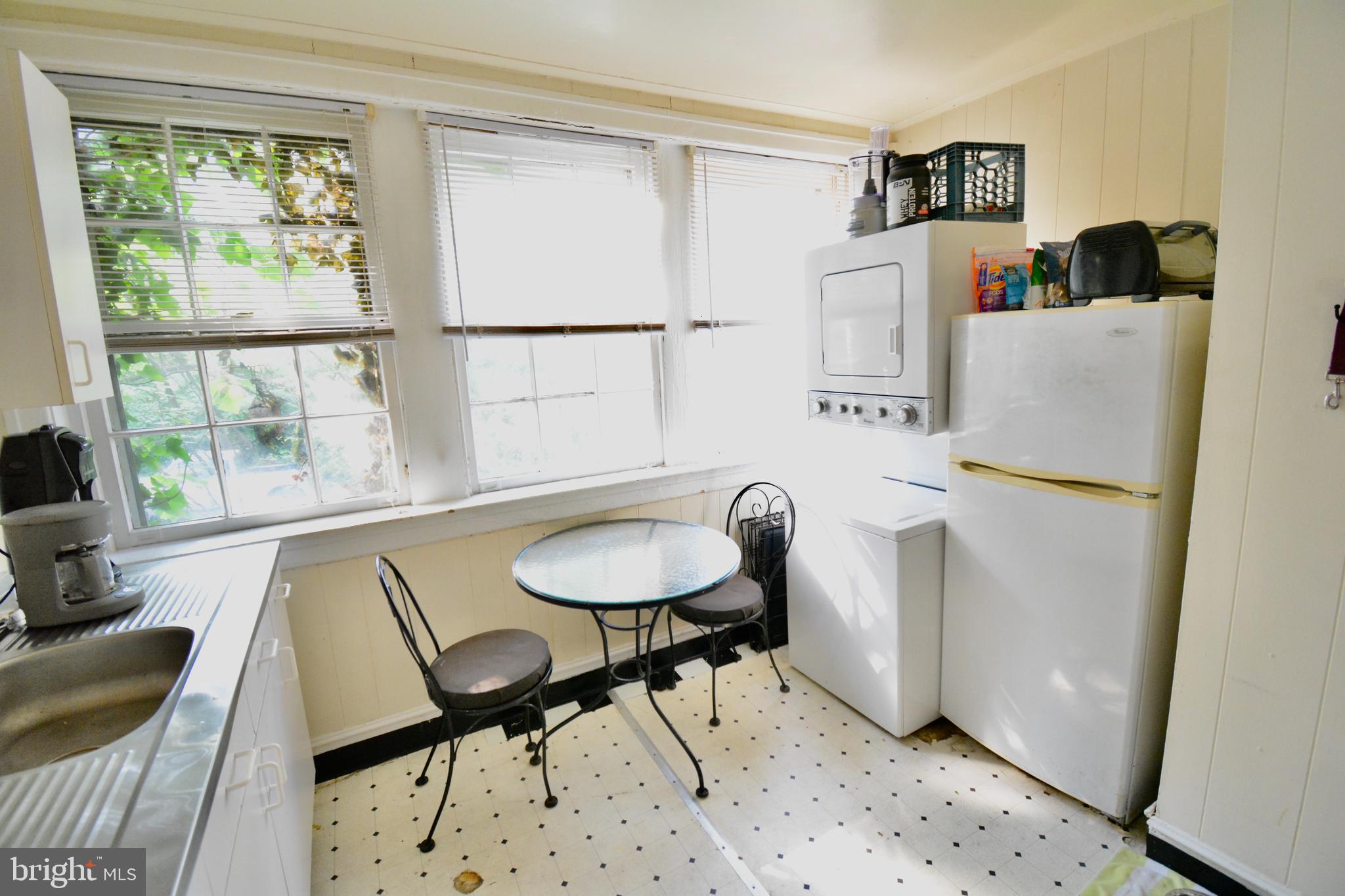 506 West Coulter Street, Unit 1 Philadelphia, PA 19144 - Photo 9 of 11 a living room with furniture and a window