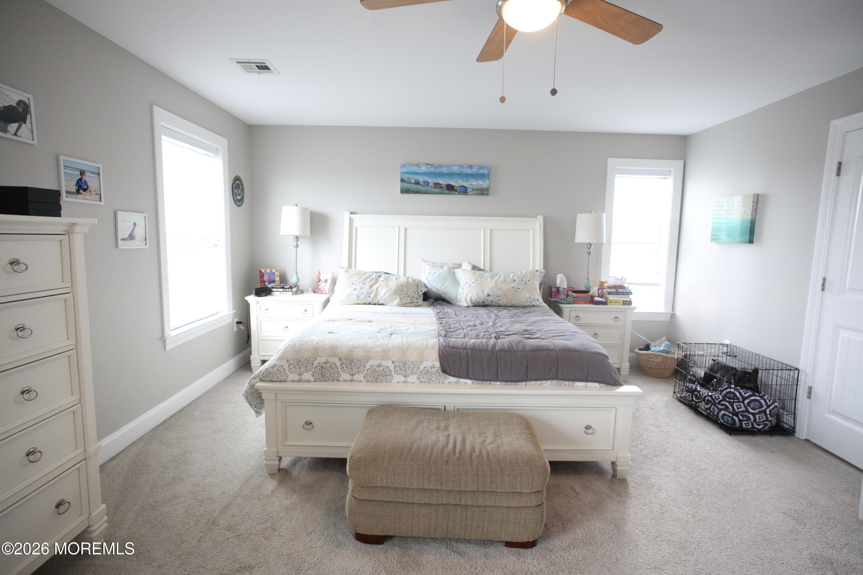 107 Waldron Road Toms River, NJ 08753 - Photo 7 of 20 a bedroom with a bed and a chandelier
