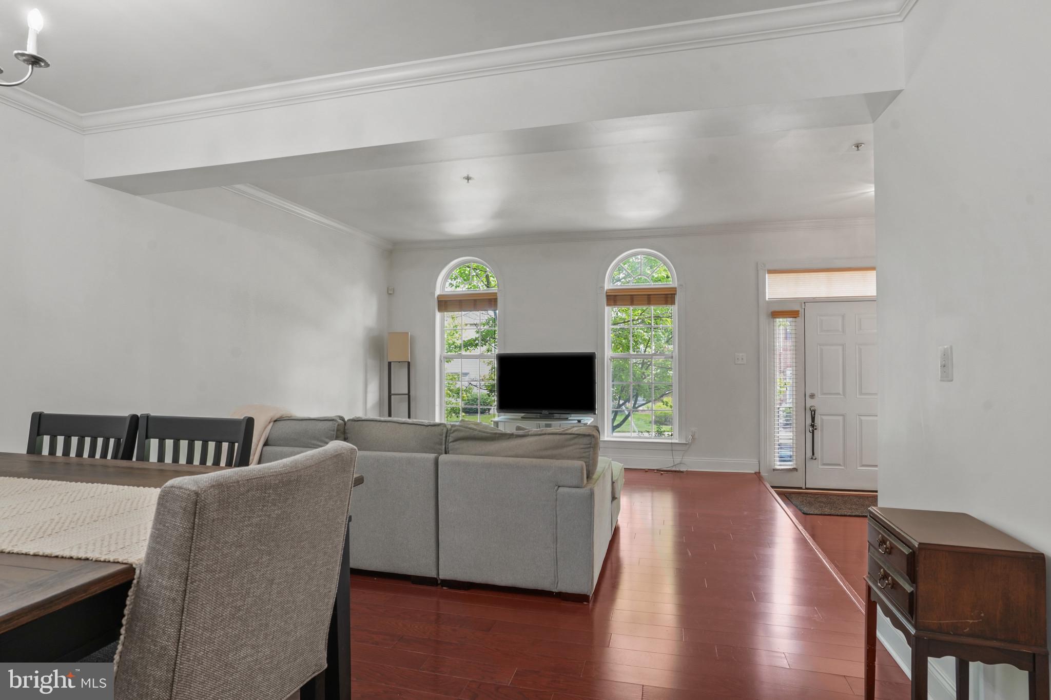 7609 Elmcrest Road Hanover, MD 21076 - Photo 7 of 37 a living room with furniture and a wooden floor