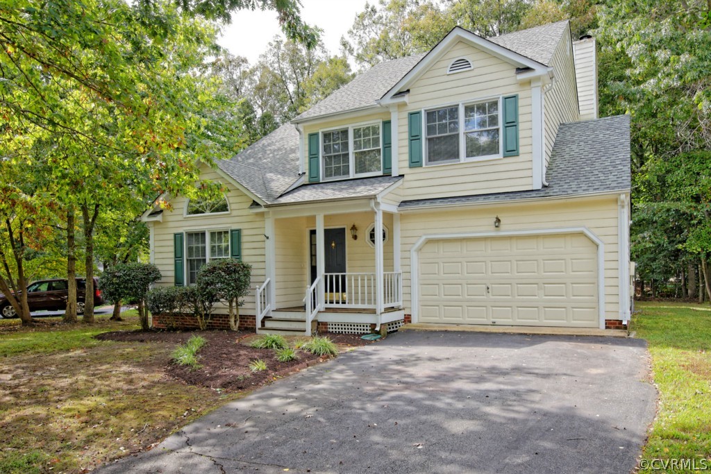 5508 Windy Ridge Drive Midlothian, VA 23112 - Photo 2 of 20 a front view of a house with a garden
