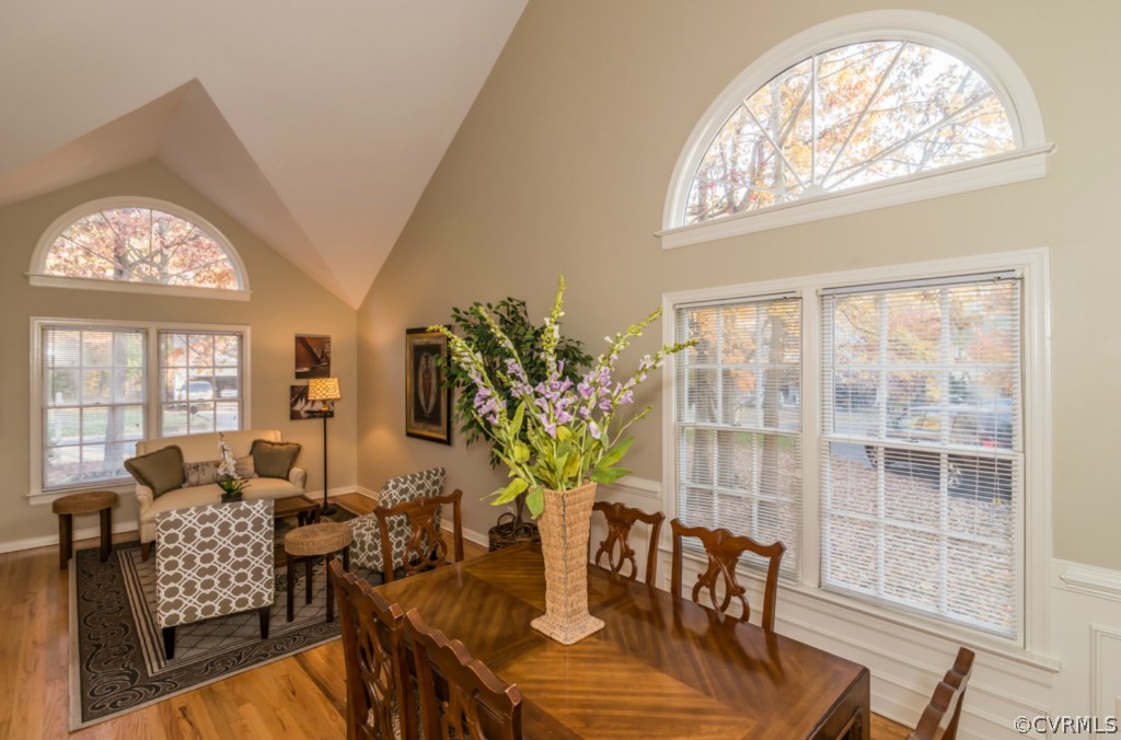 5508 Windy Ridge Drive Midlothian, VA 23112 - Photo 8 of 20 a view of a dining room with furniture a chandelier and wooden floor
