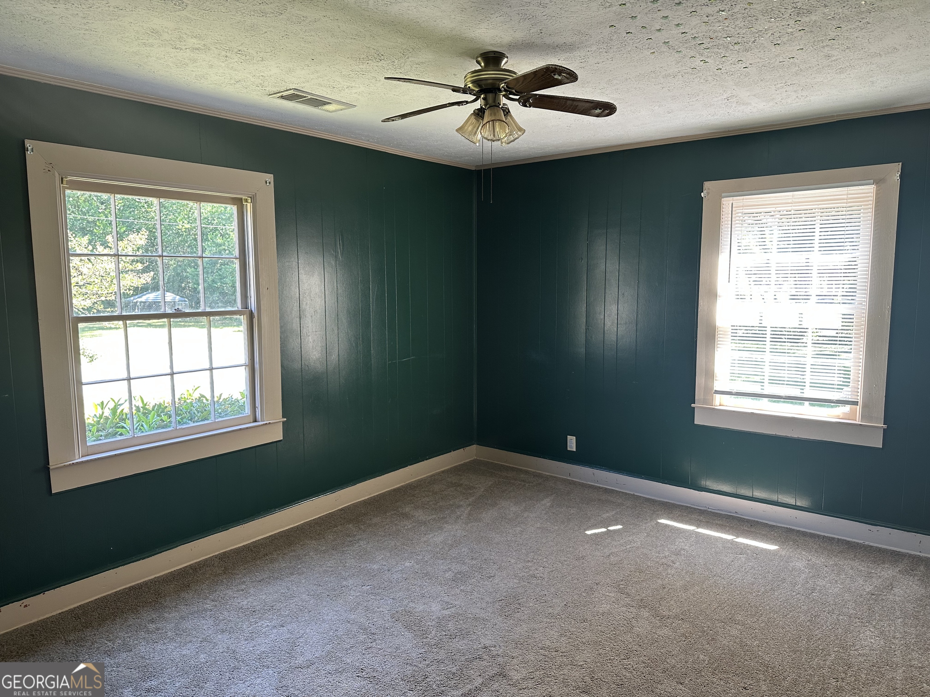 202 Geneva Street Dublin, GA 31021 - Photo 12 of 14 a view of a livingroom with an empty space and a window