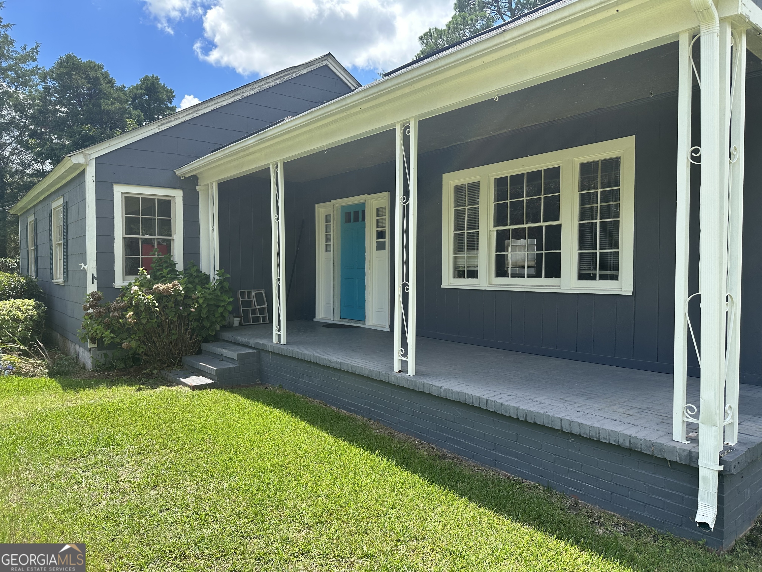 202 Geneva Street Dublin, GA 31021 - Photo 2 of 14 a view of a house with backyard and porch