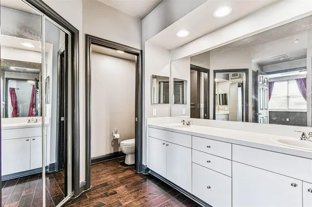 a kitchen with stainless steel appliances kitchen island granite countertop a refrigerator and a stove top oven