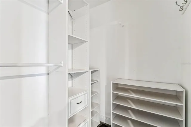 a kitchen with stainless steel appliances kitchen island a refrigerator sink and cabinets