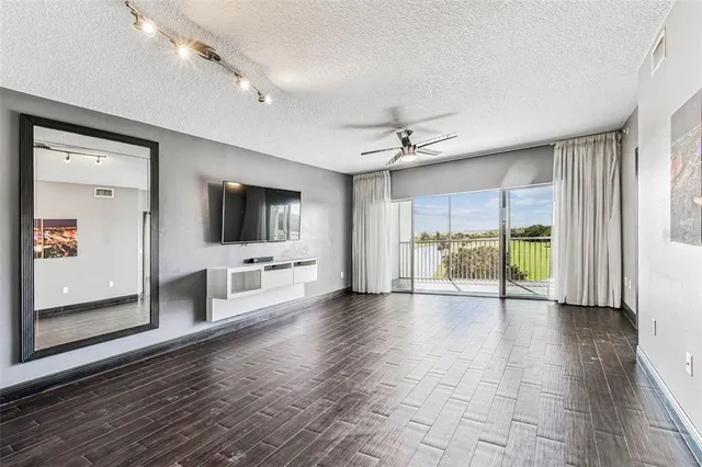 a view of a swimming pool and an outdoor seating