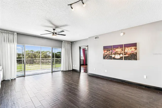 a view of a swimming pool with an outdoor space and seating area