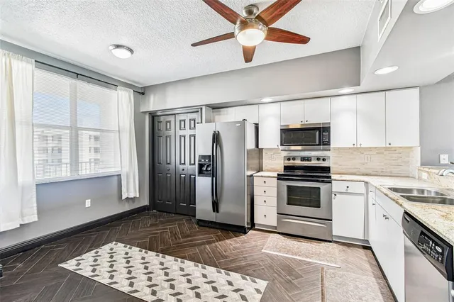 a view of a swimming pool and a chairs