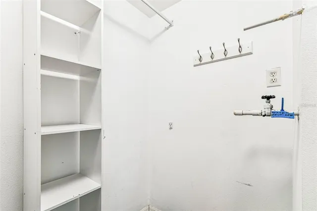 a sign broad in front of the red brick house