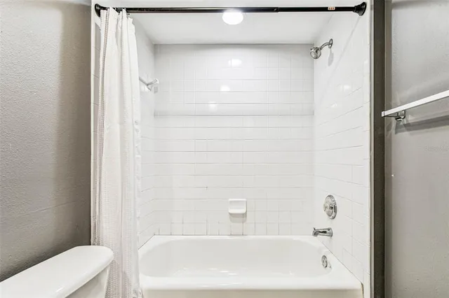 a view of a house with a swimming pool and a yard