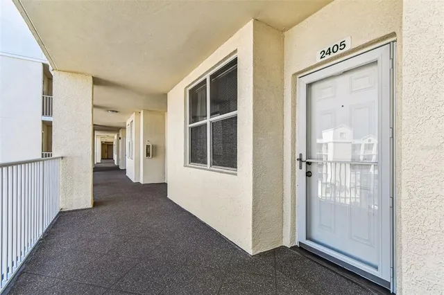 a view of a lake with houses in the background
