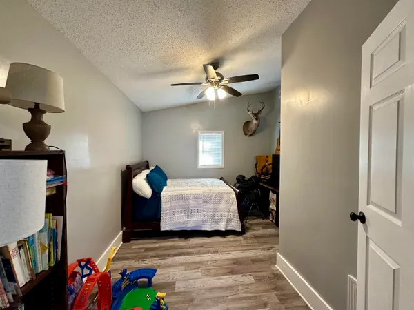 a bedroom with bed and window
