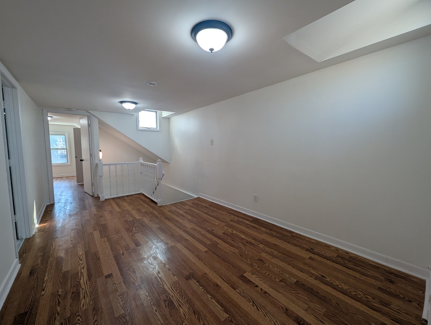 1520 West Melrose Street, Unit 2F Chicago, IL 60657 - Photo 11 of 16 a view of an empty room and wooden floor